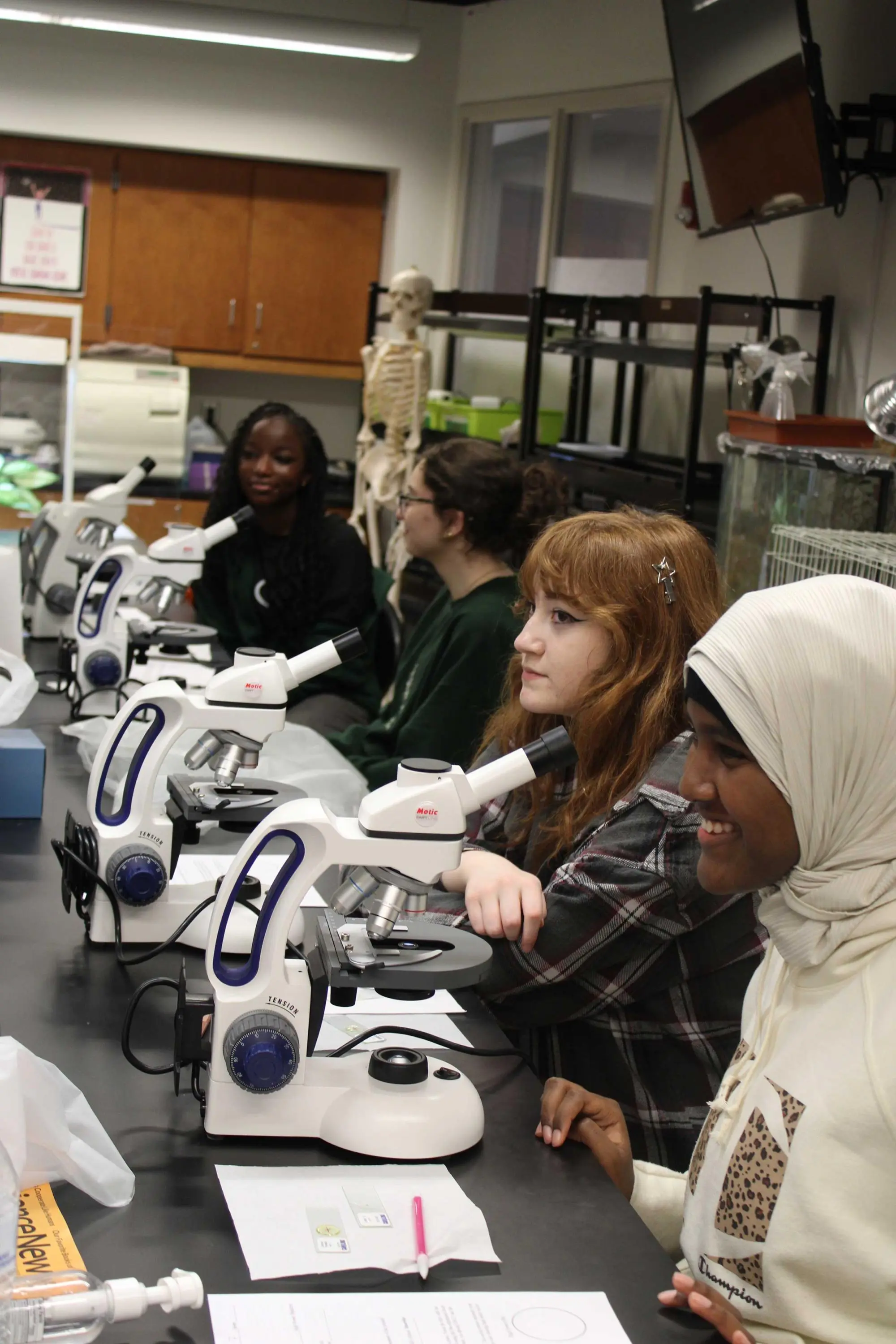 Students with microscopes