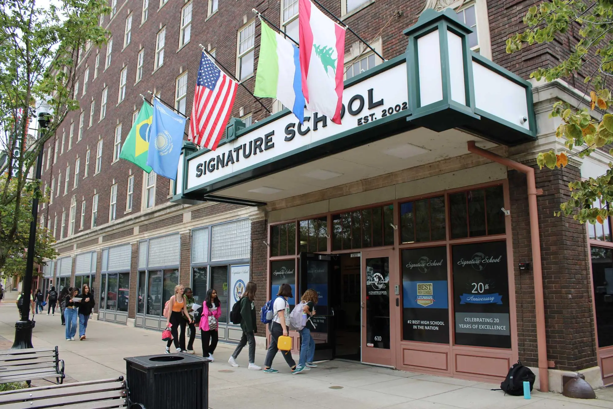 Student walking into building