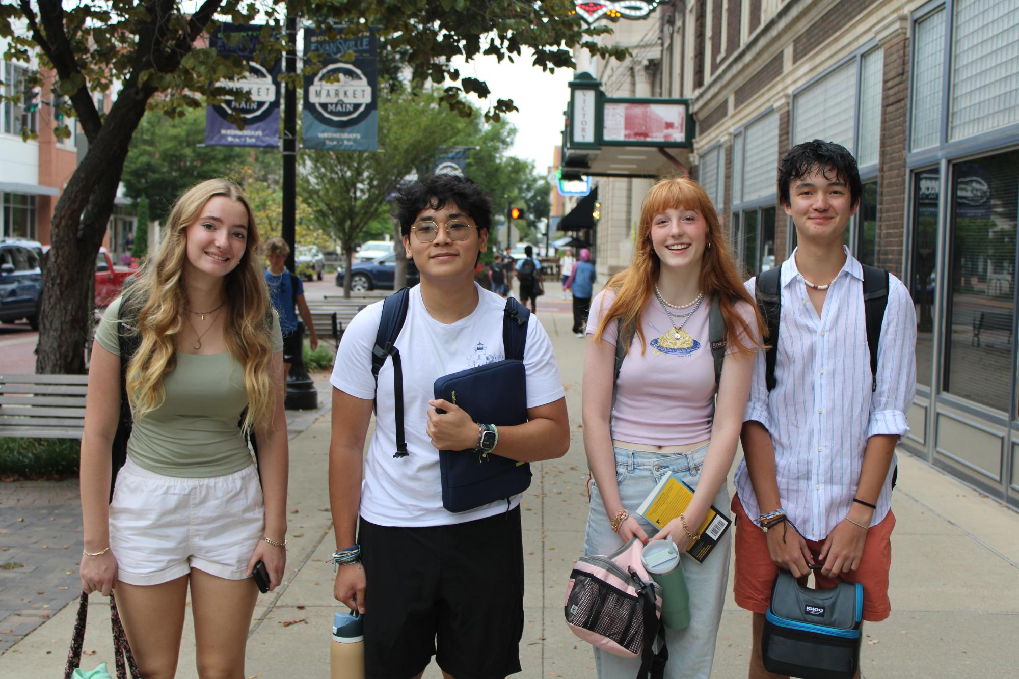 students smiling on street